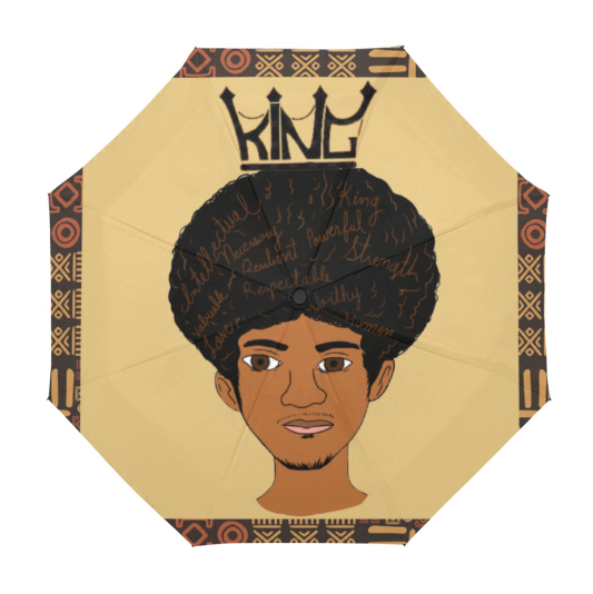 A large umbrella with a design featuring a black male figure with an afro hairstyle, surrounded by a geometric pattern in brown, beige, and black colors, with the word 'KING' crowning at the top.
