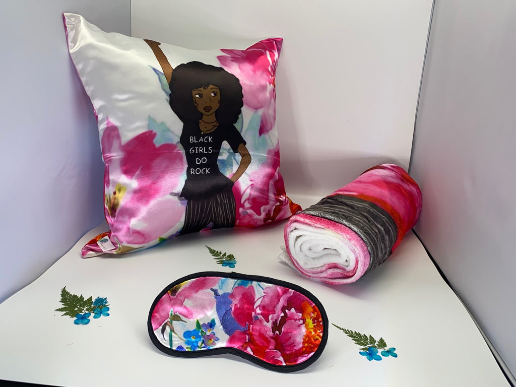 Pink and White Afrocentric Black Girls Do Rock 3-piece lounge set featuring pillowcase, eye mask, and throw blanket with joyful illustrated design celebrating Black girl culture