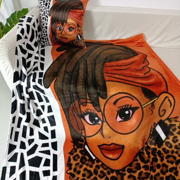 Orange and black and white blanket and pillow set with dreadlock hair design 