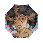 A colorful umbrella with bold pinks and blue colors, featuring a vibrant cartoon illustration of a black woman with a natural afro hairstyle, wearing heart-shaped glasses, and bright red lipstick, and bold earrings. 