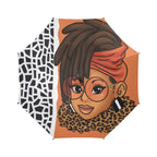 Orange and black and white pattern accents, full-size polyester umbrella featuring an elegant Afrocentric illustration of a woman with long loc’d hair, gold-toned accents, luxury-inspired graphic pattern, semi-automatic open canopy, and straight handle