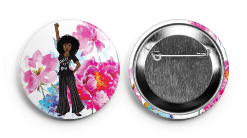 a pin showing a black girl holding her fist up 