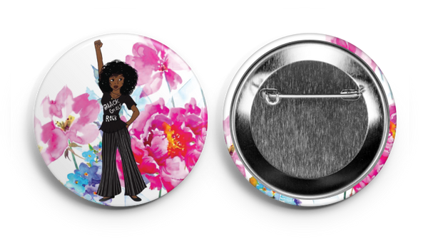 a pin showing a black girl holding her fist up 